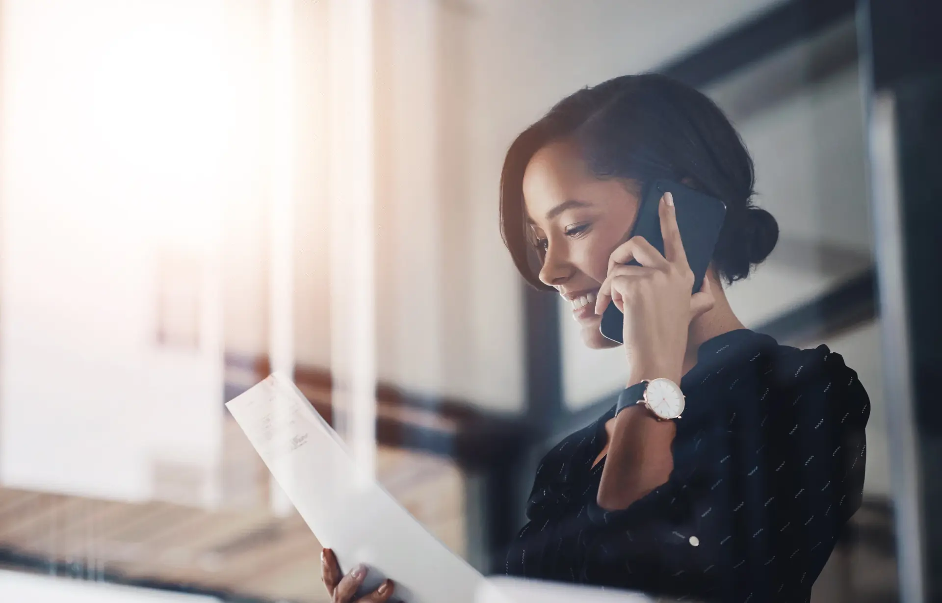 A client on the phone with NJ Middleton Attorneys, reviewing documents